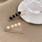 Broche imperdible con perlas y strass de fantasía