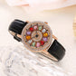 Reloj de Mujer con Esfera Giratoria y Diamantes Simulados de Colores