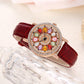 Reloj de Mujer con Esfera Giratoria y Diamantes Simulados de Colores