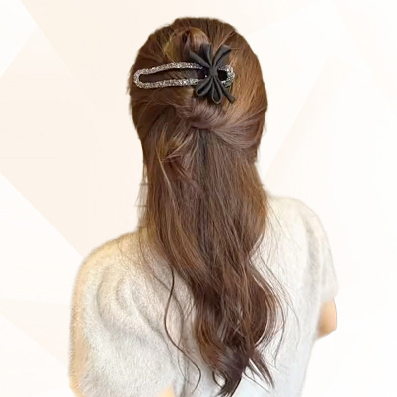 Elegante horquilla con lazo negro brillante para recogidos