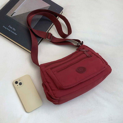 Bolso bandolera ligero de nailon con múltiples bolsillos