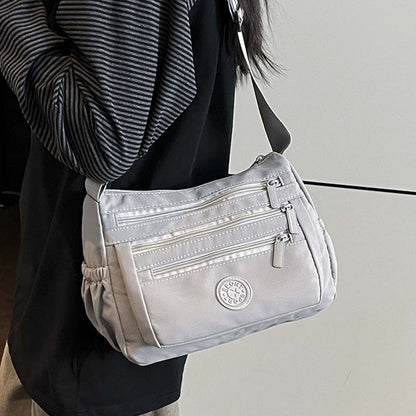 Bolso bandolera ligero de nailon con múltiples bolsillos