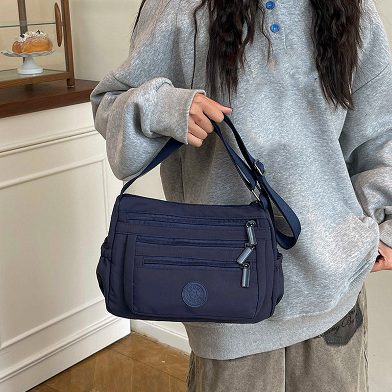 Bolso bandolera ligero de nailon con múltiples bolsillos